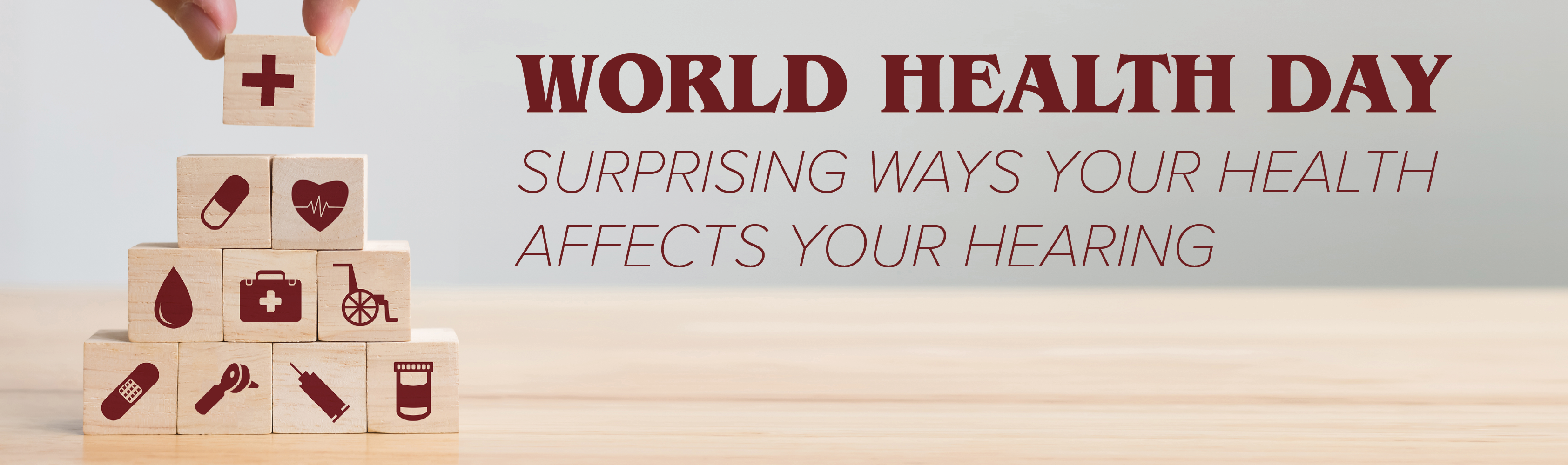 Blocks stacked to form a pyramid, featuring health-related icons, with the text "World Health Day: Surprising ways your health affects your hearing.