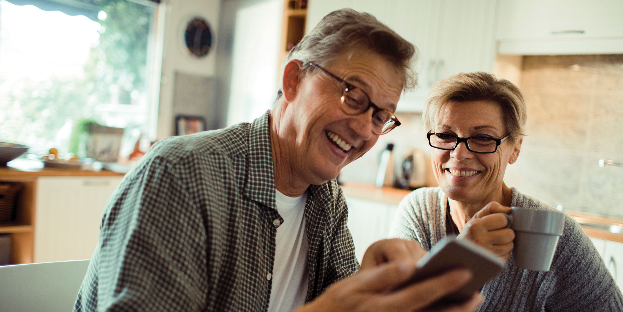 Couple using hearing aid technology for their smartphones